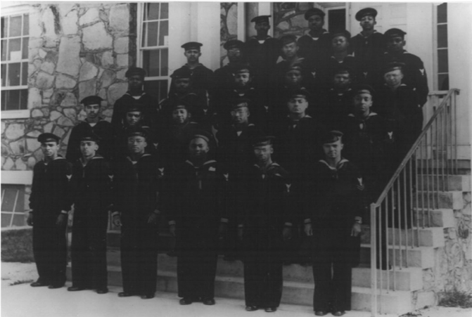 Navy Band B-1 standing on the steps of their barracks.