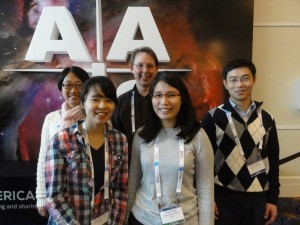 The exoplanets.org team at the National Harbor AA meeting — I mean American Astronomical Society meeting.  From left: Sharon Wang (grad student, PSU), Eunkyu Han (now at Boston University), me, Katherina (Ying) Feng (now at UC Santa Cruz), and Ming Zhao (Research Associate, PSU).
