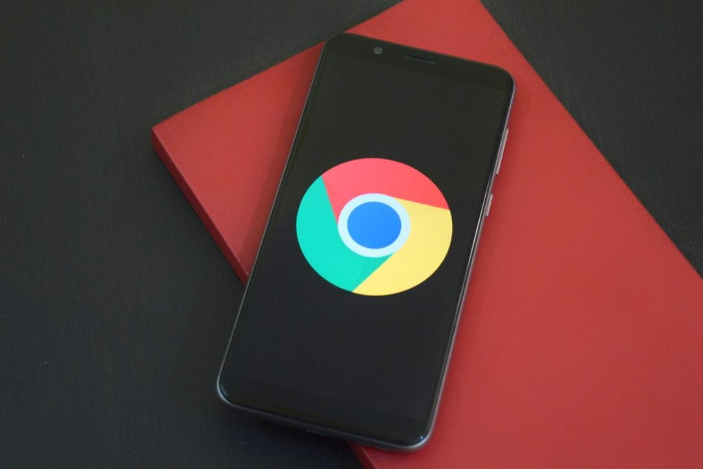 Google Chrome logo on black smartphone screen