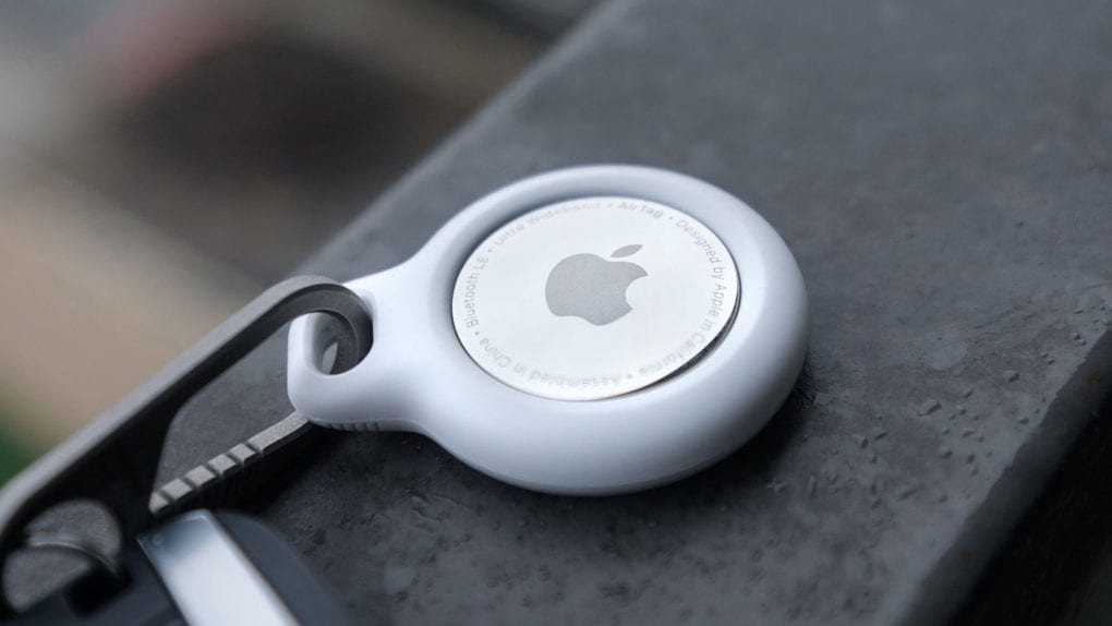 Close up photo of white Apple AirTag on clip