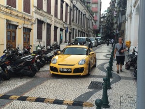 A sports car casually prowling the historic tiled streets.