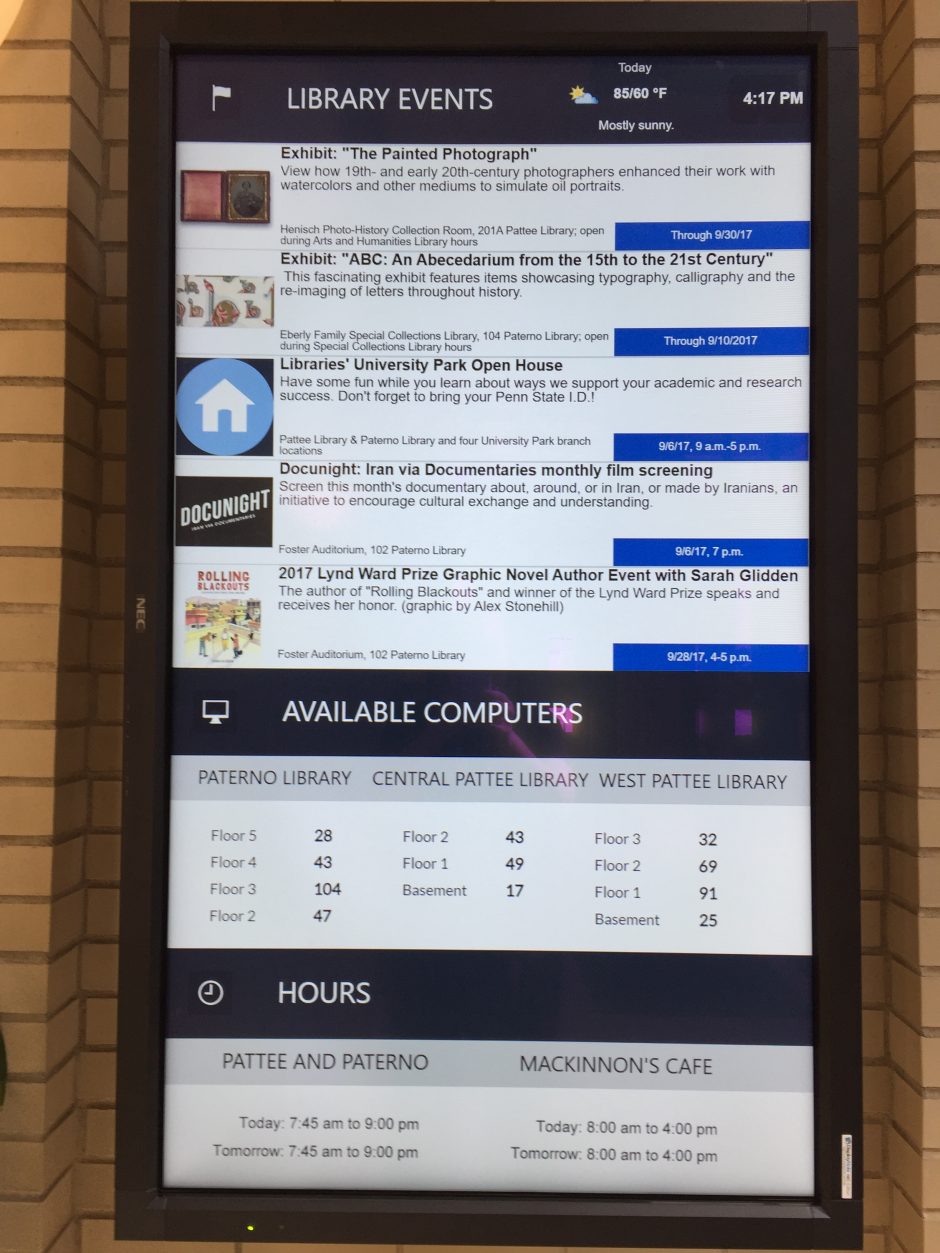 vertical image of large digital screen showing library information including upcoming events, available computers, and today and tomorrow's hours