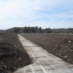 photo of rows of material in the compost piles
