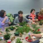 PSEOP members working with evergreen to create centerpiece