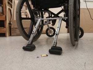 Full Stop: A portable add-on to prevent unwanted wheelchair motion.
