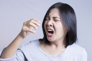 woman-sneezing