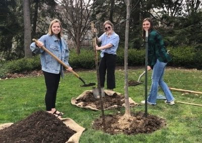 (From Left) Nora Van Horn, 2022 Tree Award Recipient, planting a tree in her honor along side 2022 SSAC Co-chairs Eliana Wagner & Alysha Ulrich. 